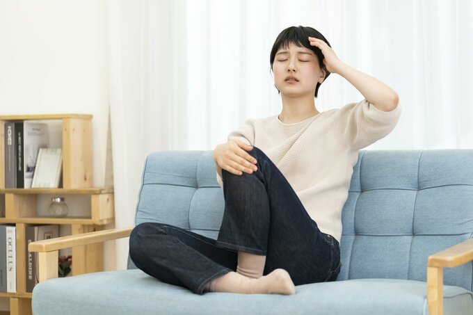 体調不良の女性