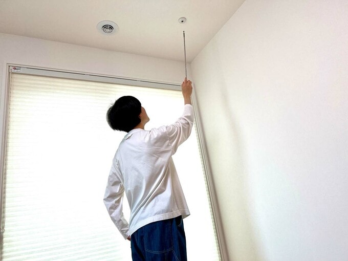 室内物干し竿を取り外す