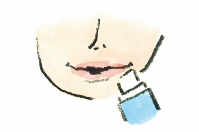 唇にリップを塗るイラスト