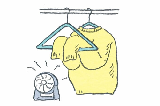 ハンガーにかけられたニットのイラスト