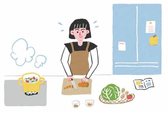 節約料理を作る女性