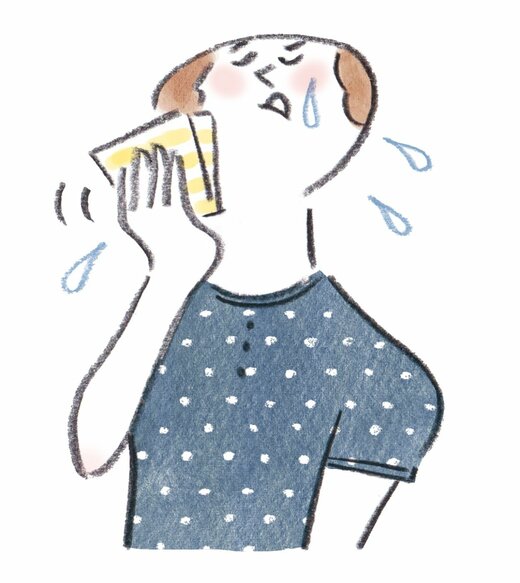 汗をかく女性