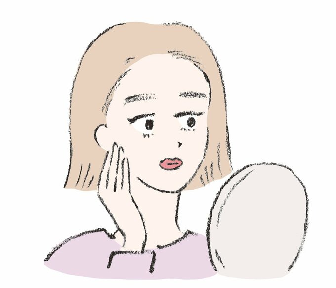 鏡を見ている人