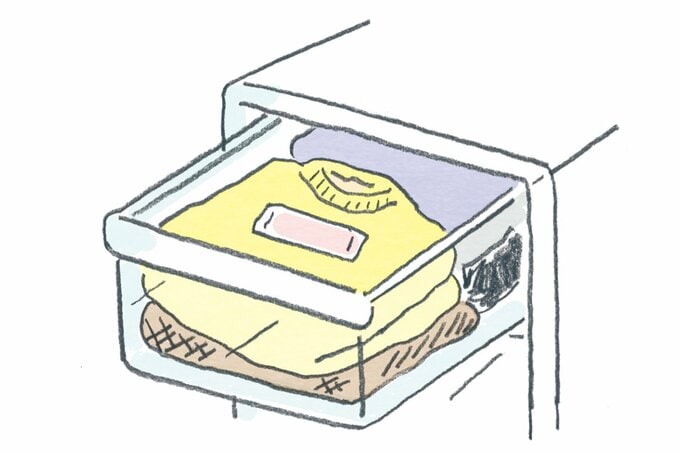 収納ケースに入れられたニットのイラスト