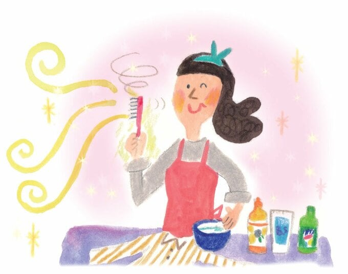 歯ブラシをもつ女性