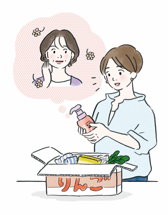 ダンボールをあける女性