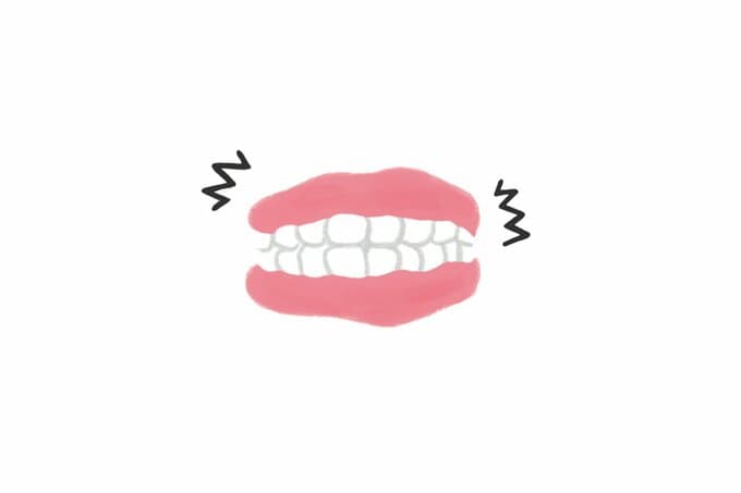 歯をかみしめる口のイラスト