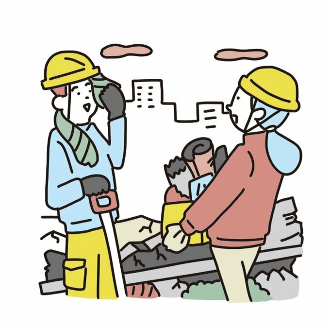 がれきを片づける人々