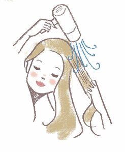 髪を引っぱりながらドライヤーを当てて