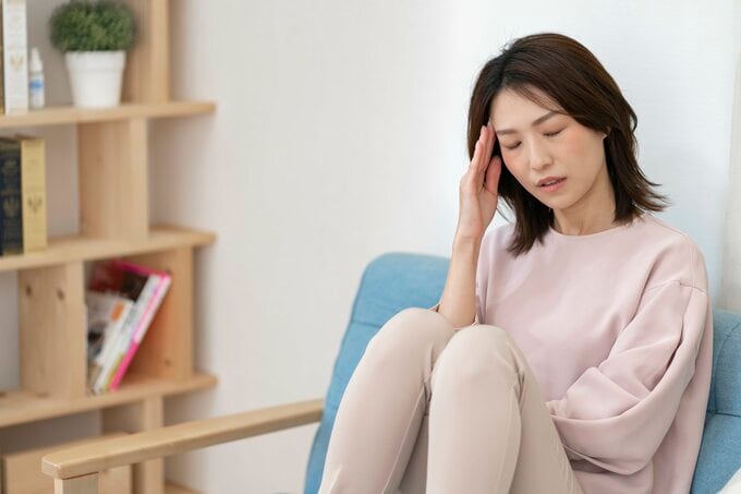 体調不良の女性