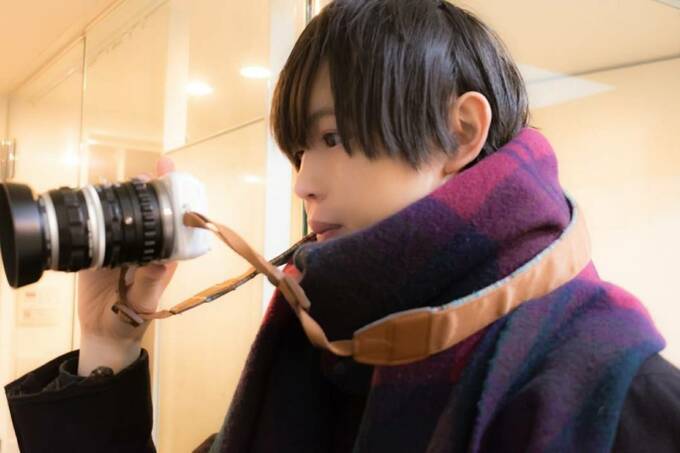 カメラを構える光さん