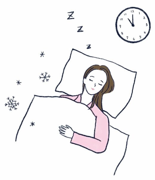 布団で眠る人