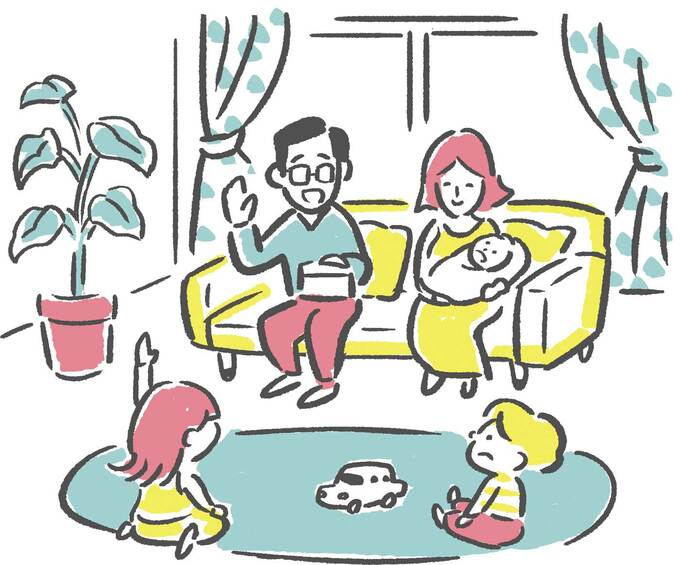 リビングで過ごす家族