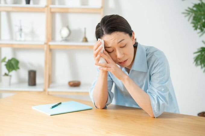 具合が悪い女性
