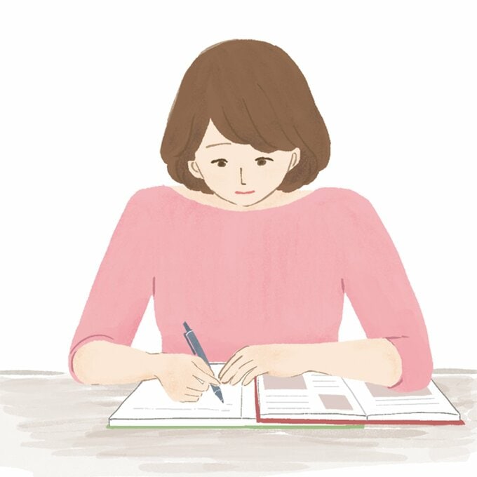 机で勉強をする女性のイラスト