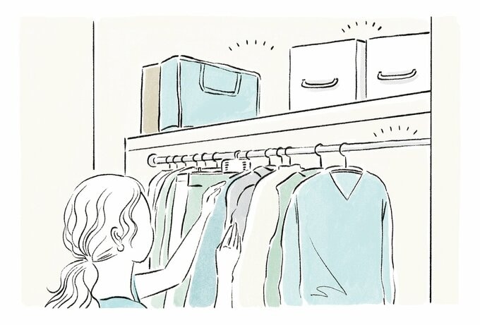 クローゼット内の衣類に触れる女性のイラスト