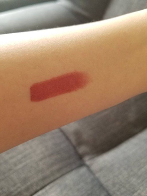 腕に154カラーをつけた様子