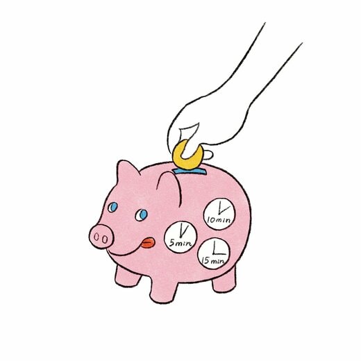 時計のイラストが描かれたピンクのぶたの貯金箱