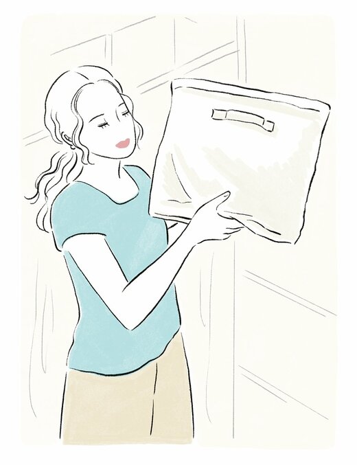 布製の収納ケースを持つ女性のイラスト