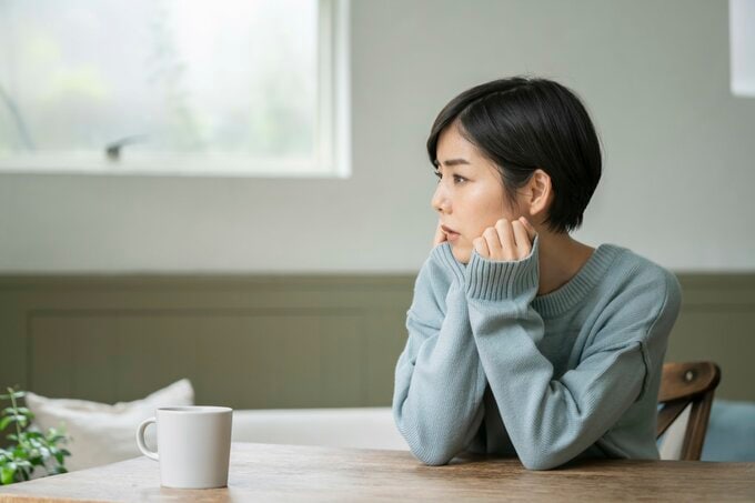 体調不良の女性