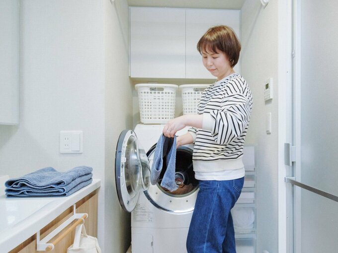 洗濯をする本間さん