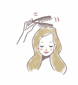 頭頂部を中心にブラシで軽やかにパッティング