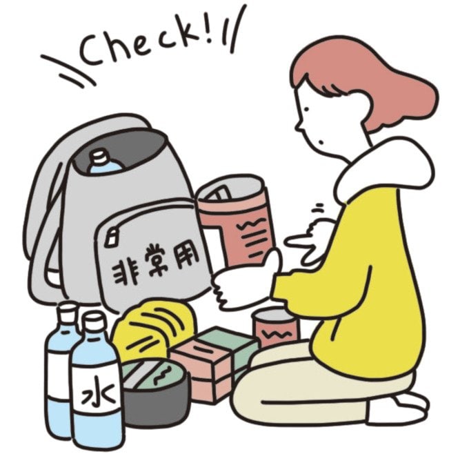 非常用持ち出し袋と女性のイラスト