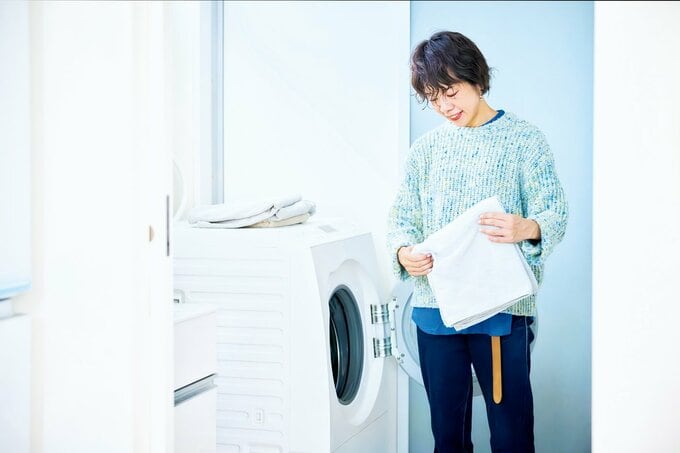 洗濯をするハギヤマジュンコさん