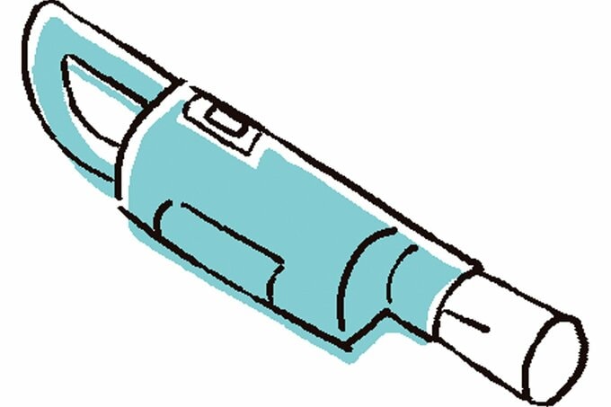 掃除機の吸引口にトイレットペーパーの芯を入れる