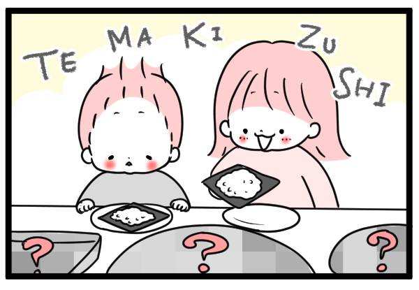 手巻き寿司をつくる子ども2人
