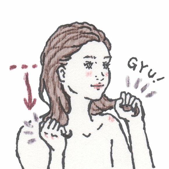 毛先を両手で握る