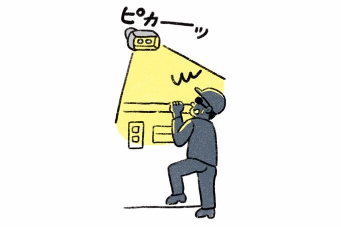 ライトに驚く男のイラスト