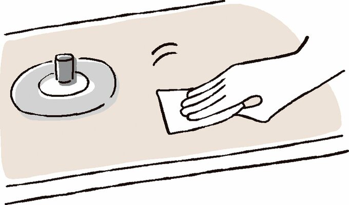 コンロ掃除をする人のイラスト