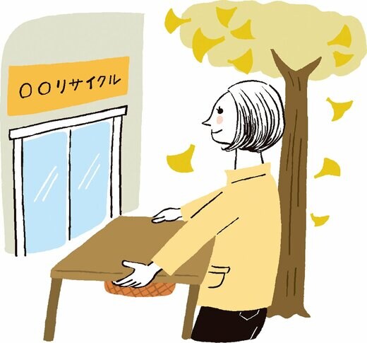 こたつ机をリサイクルショップに持ち込む女性