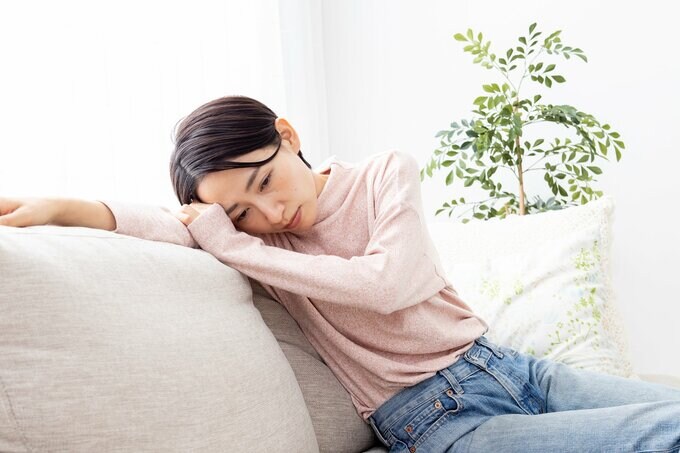 体調不良の女性