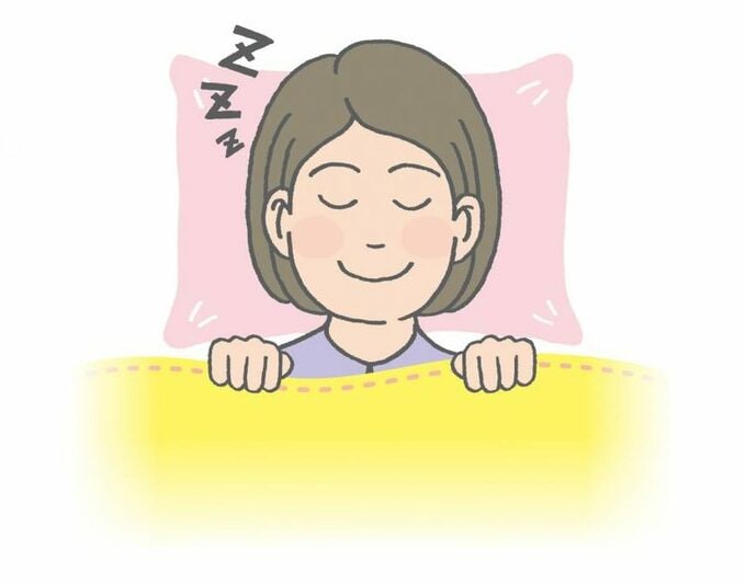 布団に入る女性