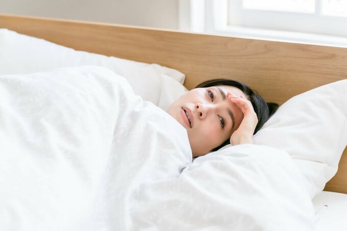 体調不良の女性