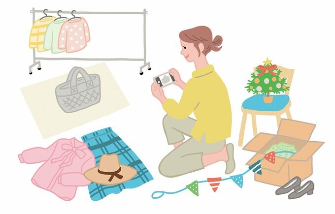 イラスト衣類の写真をとる女性