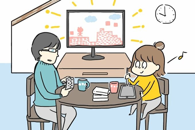 ゲームをする男性と絵を描く女性